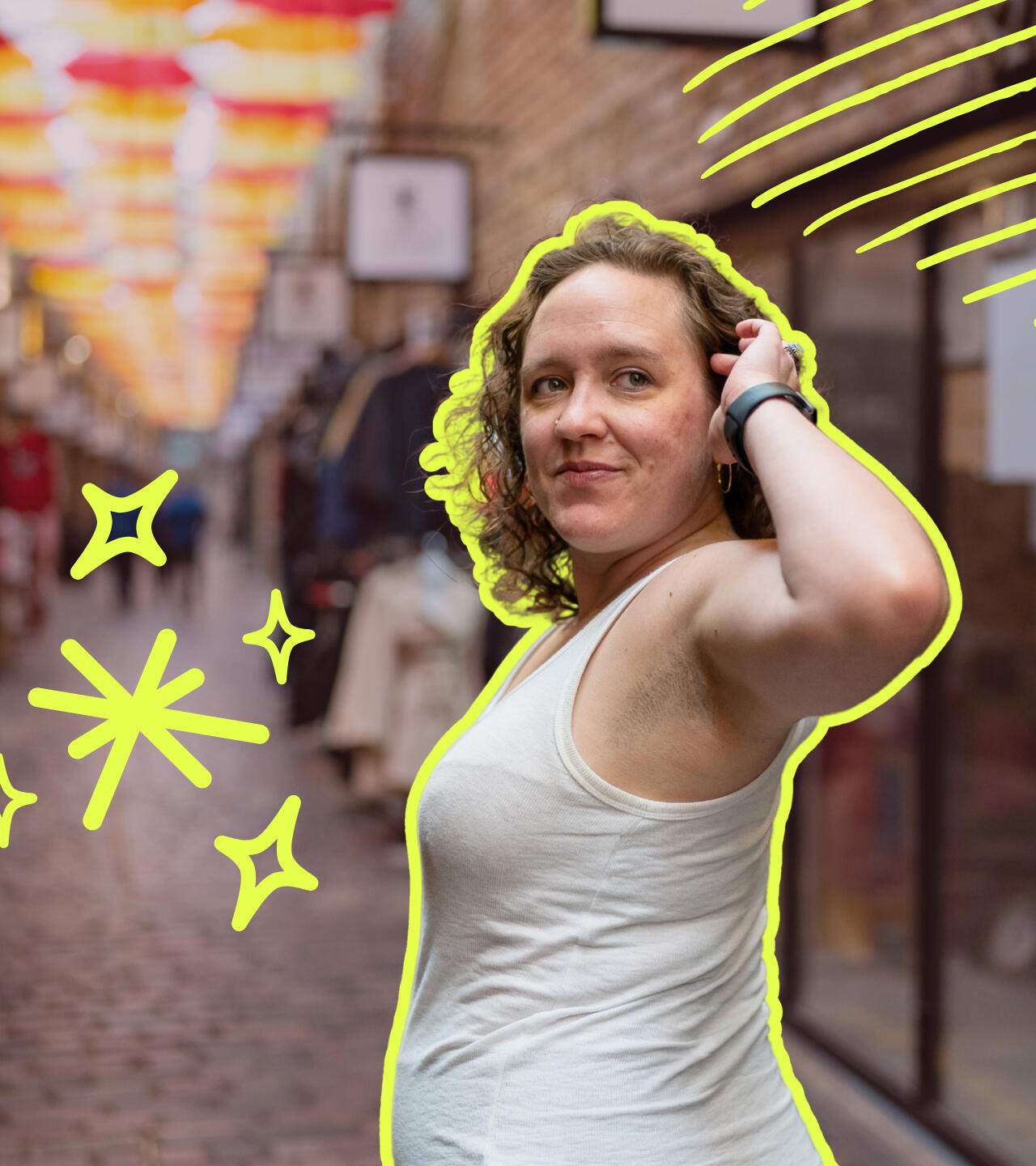 Carly Franklin, meditation coach Carly looks back over her shoulder as she walks along a covered market path, a playful smile curls on her lips, and her hand absently pushes back a lock of hair.